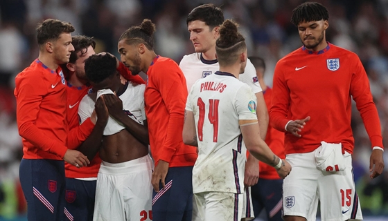 Life + Style: racist attacks English footballers exchange a penalty kick