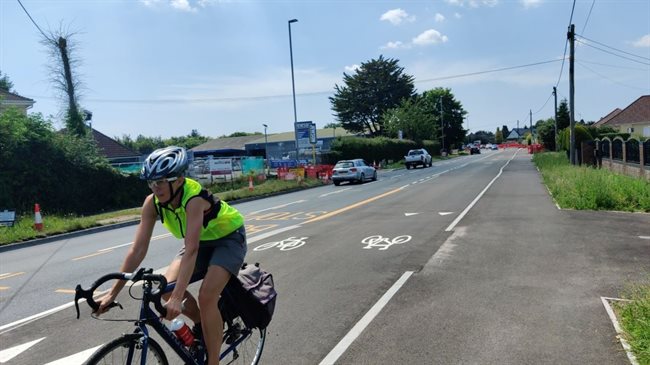 Cyclists are happy, truck drivers are damned.  This bike path created a mess